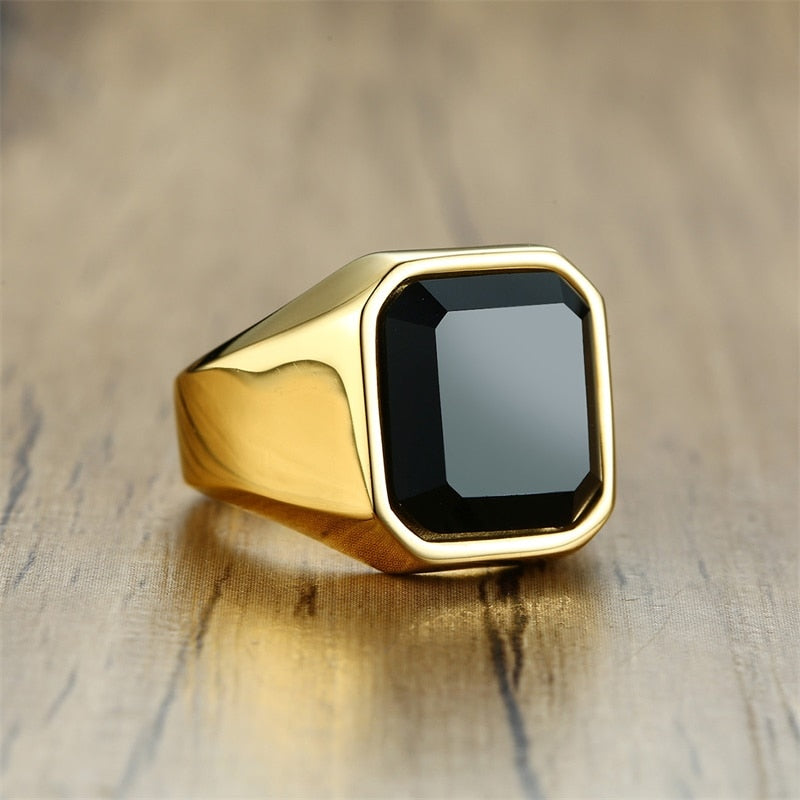 gold ring with black stone