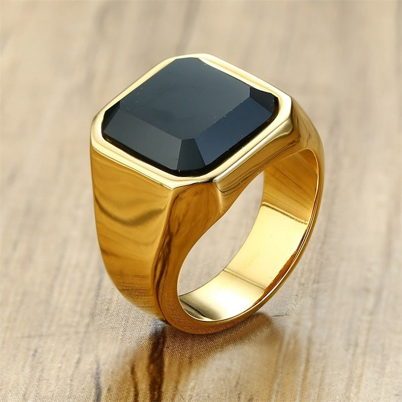 gold ring with black stone